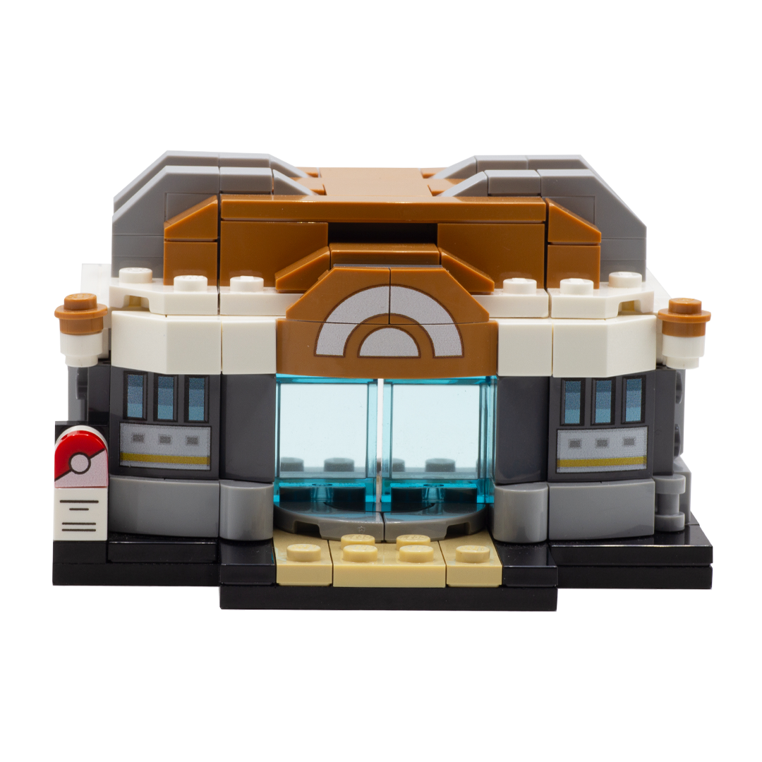 A custom LEGO minibuild depicting a Pokemon Training Gym, featuring brown, white, gray, black, and beige bricks and transparent blue doors which can open and shut. 