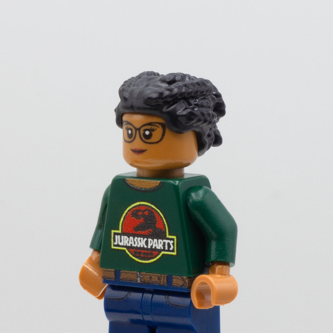  A LEGO custom minifigure wearing a black LEGO minifigure hair accessory - braided hair pulled up into a bun. 