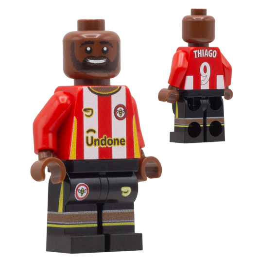 A custom-built toy minifigure of Brentford FC footballer Thiago. The figure is wearing a red and white striped jersey with 'Thiago' and the number '9' on the back, and 'Undone' on the front, paired with black shorts.