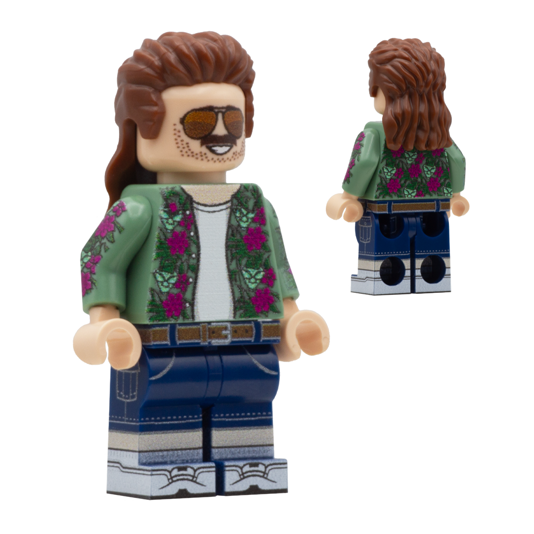 Custom Design LEGO Minifigure of Cal Hampton from GTA 6  - The figure is a Caucasian male wearing a green shirt with flowers and aliens on it. He has a long brown mullet, he is wearing sunglasses, a moustache and light stubble with a smile. He is wearing denim shorts.