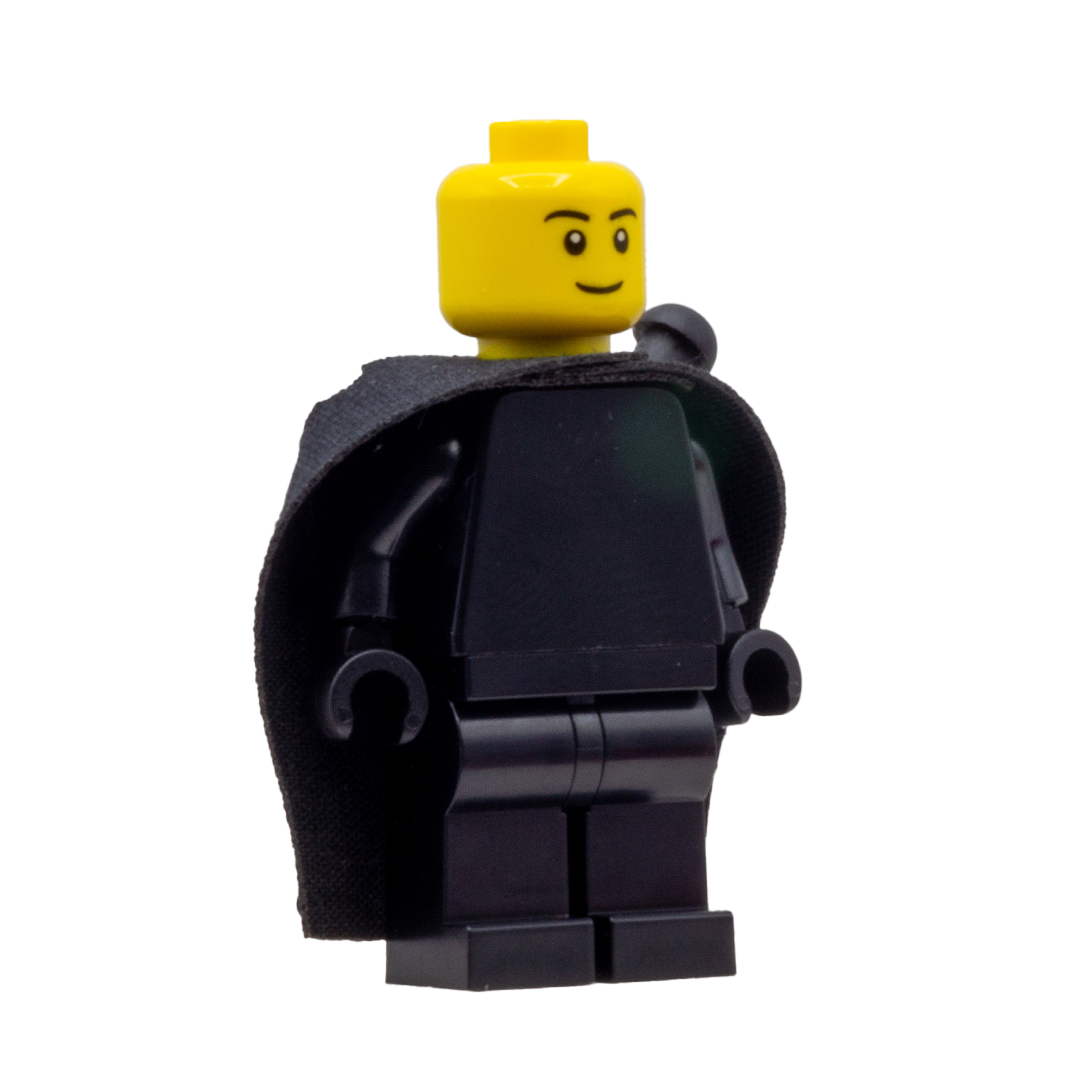 Front view of a minifigure wearing a black fabric cape with slots for LEGO swords.