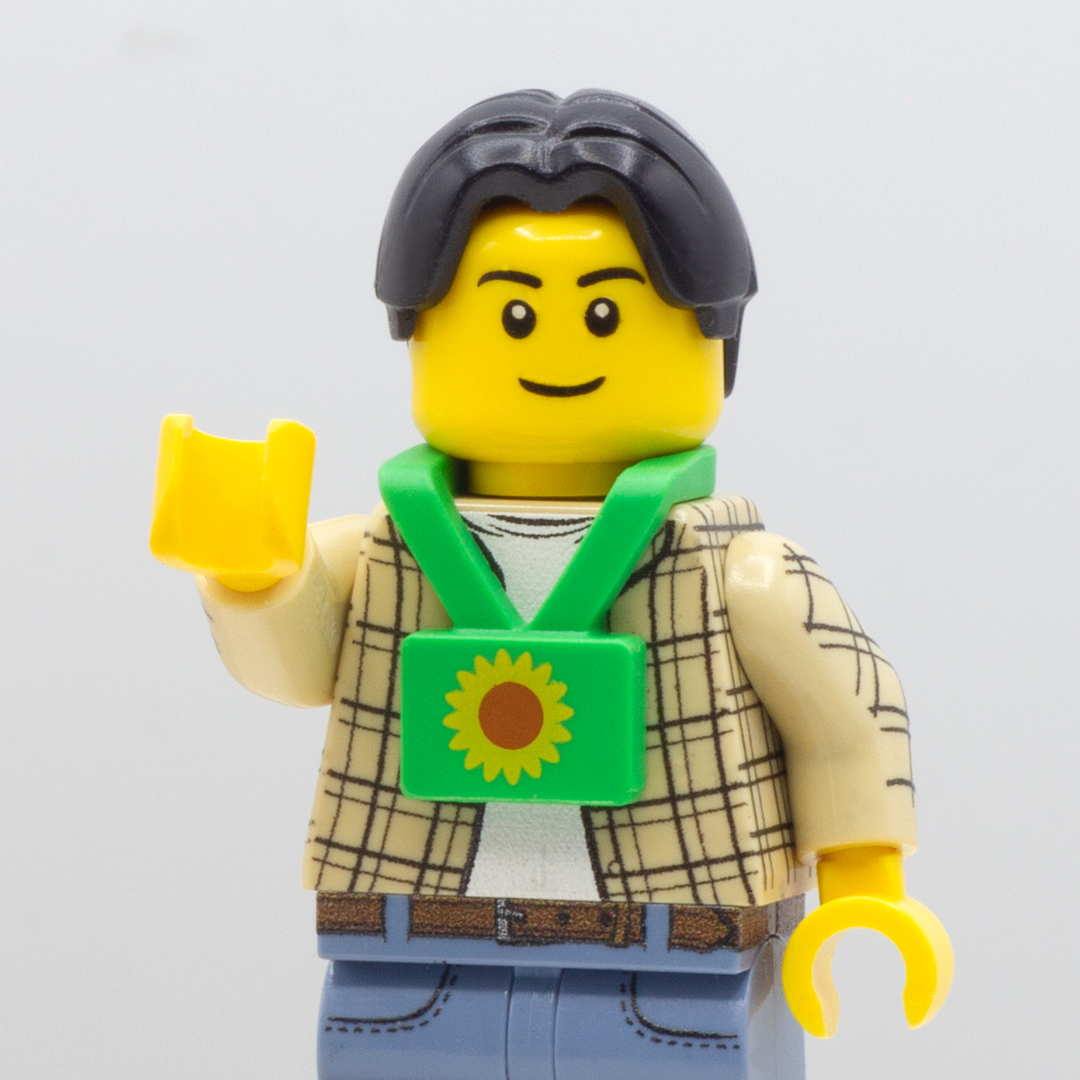 LEGO Minifigure wearing a green LEGO lanyard with sunflower printed on it.