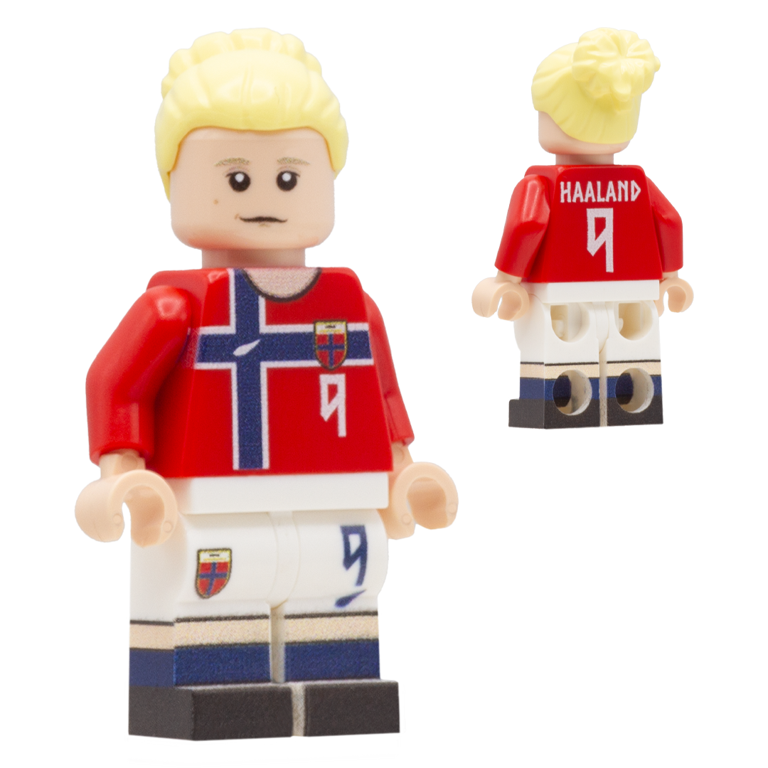 A LEGO minifigure depiciting Erling Haaland with blond hair, a light complexion face; wears a red and white Norway football kit with the text '9' on the front and 'HARLAND 9' on the back, along with white shorts and blue socks.
