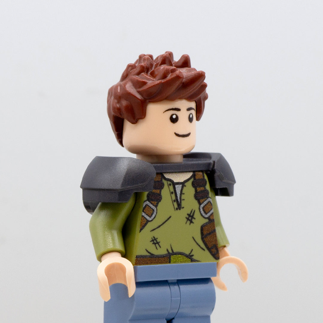 Minifigure wearing dark grey LEGO minifigure armour shoulder pads.