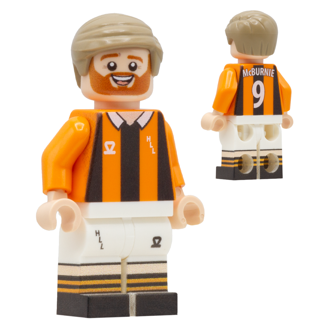 A custom Lego-style football minifigure of Hull City FC footballer Oli McBurnie. The figure wears a black and orange striped jersey, white shorts.