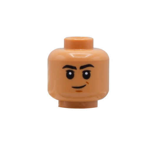 LEGO minifigure head in Nougat Flesh skin tone with big eyes, thick black eyebrows and one-sided smile.