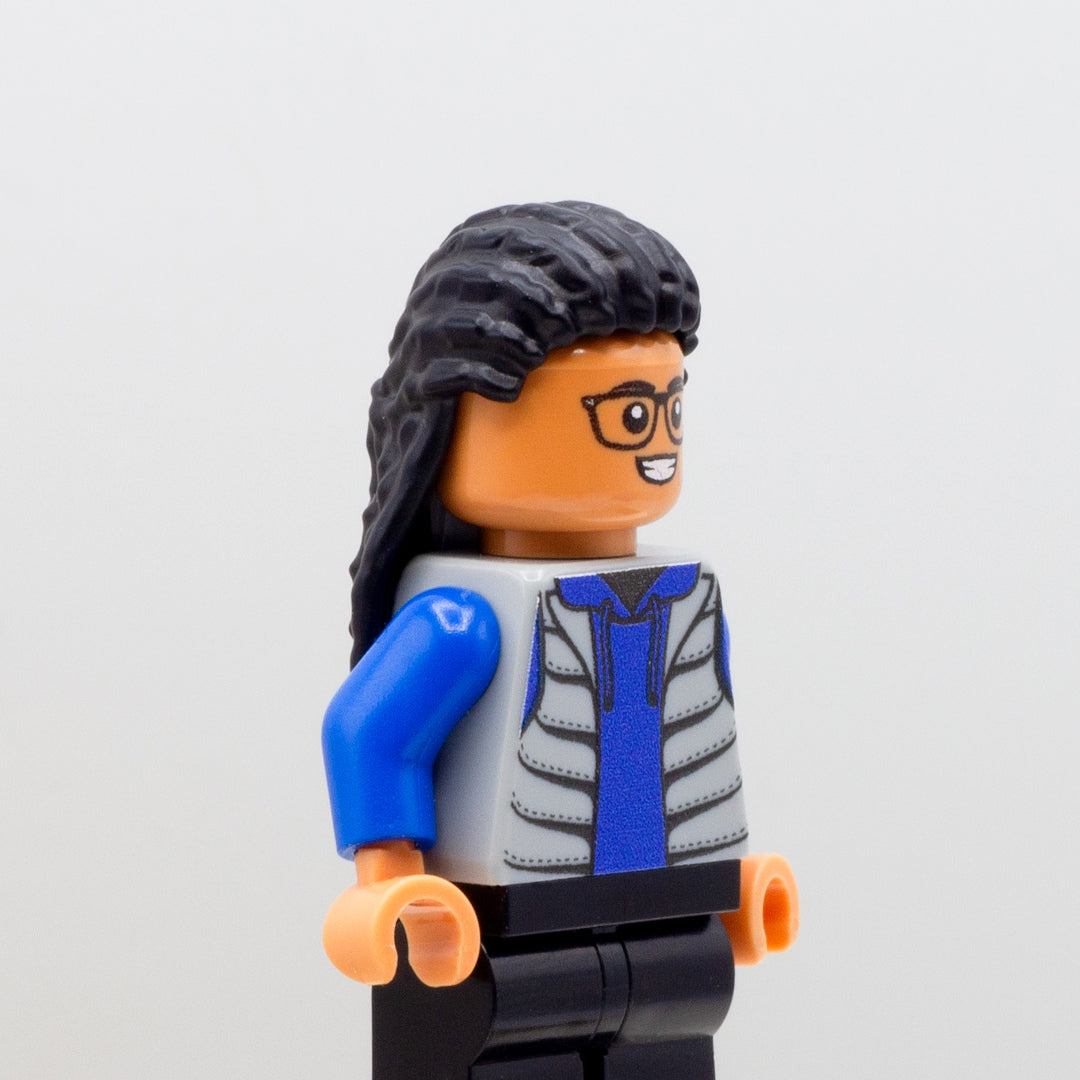 LEGO minifigure wearing long black dreadlocks in a half-up do.