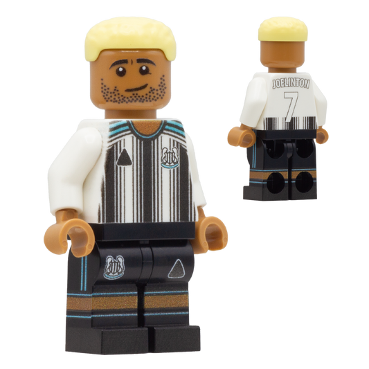 A LEGO-style soccer minifigure of Newcastle United footballer Joelinton. The figure has a tan skin tone, blond hair, and a striped white and black jersey with a club crest, plus black shorts with blue accents.