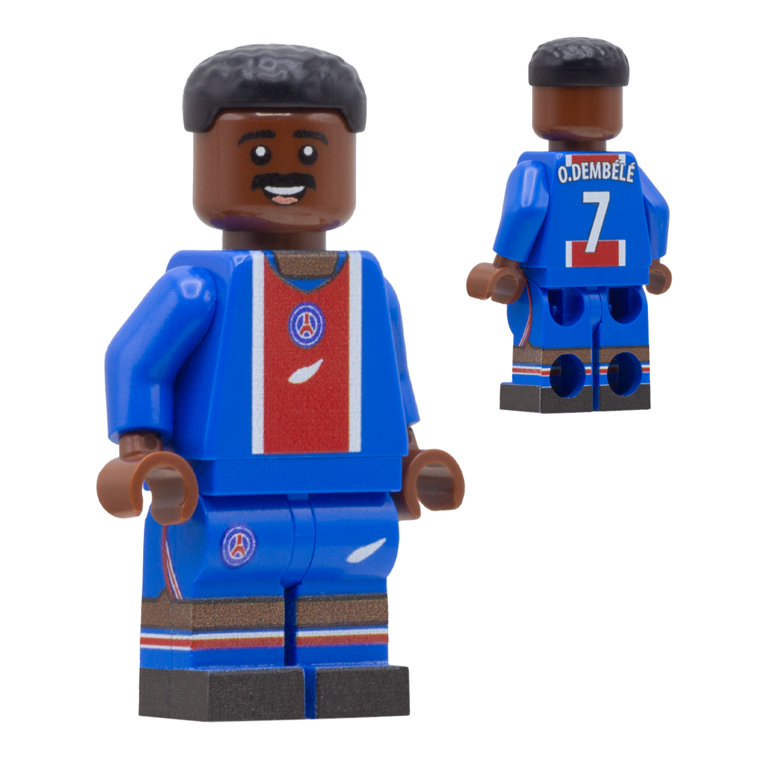 A toy minifigure of PSG footballer, Ousmane Dembele. The figure wears a blue soccer jersey and shorts with a red chest panel, white trim, and a circular crest.