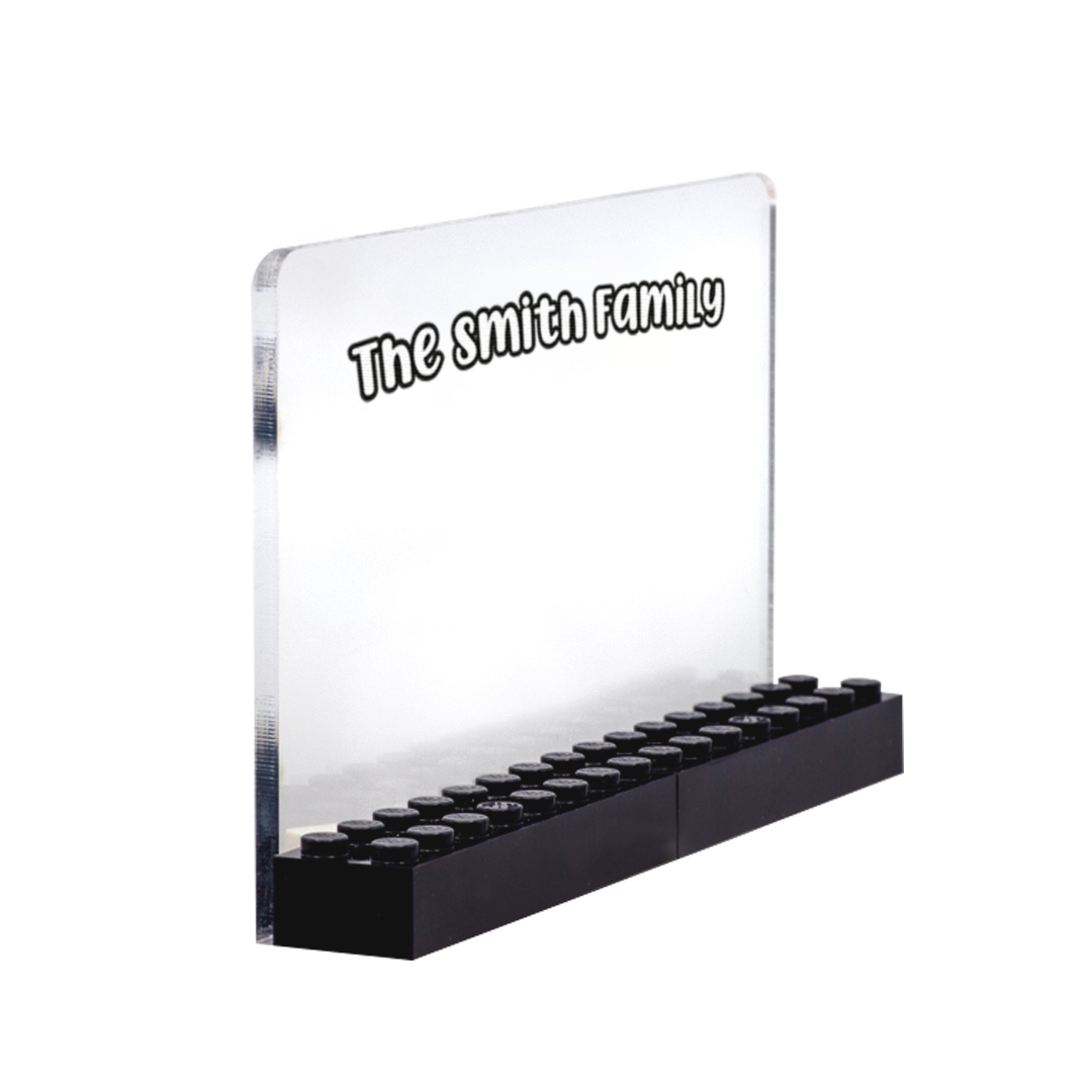 A personalized display with 'The Smith Family' printed on a clear transparent acrylic piece with a white background