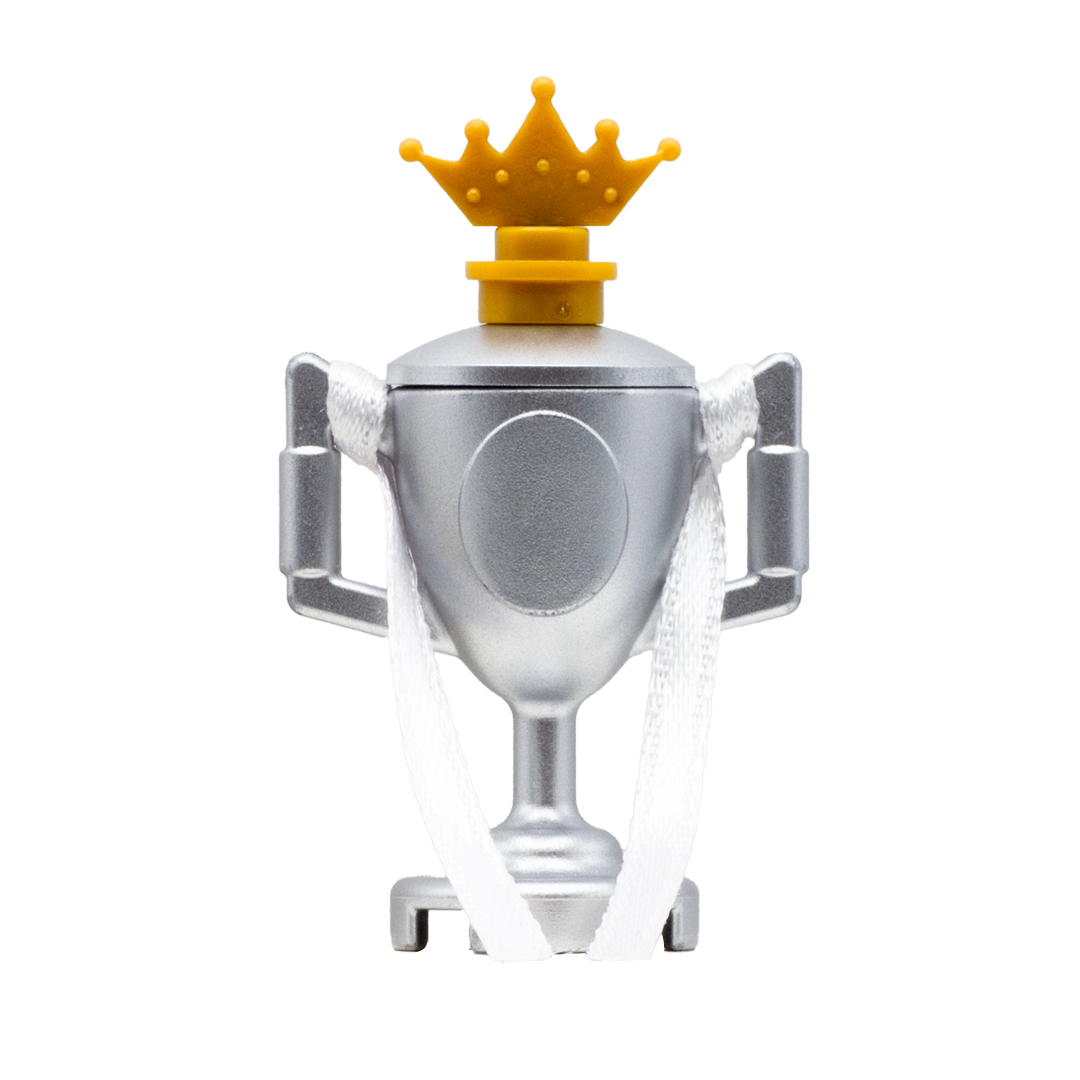 LEGO minifigure silver trophy with white ribbon and a golden crown.