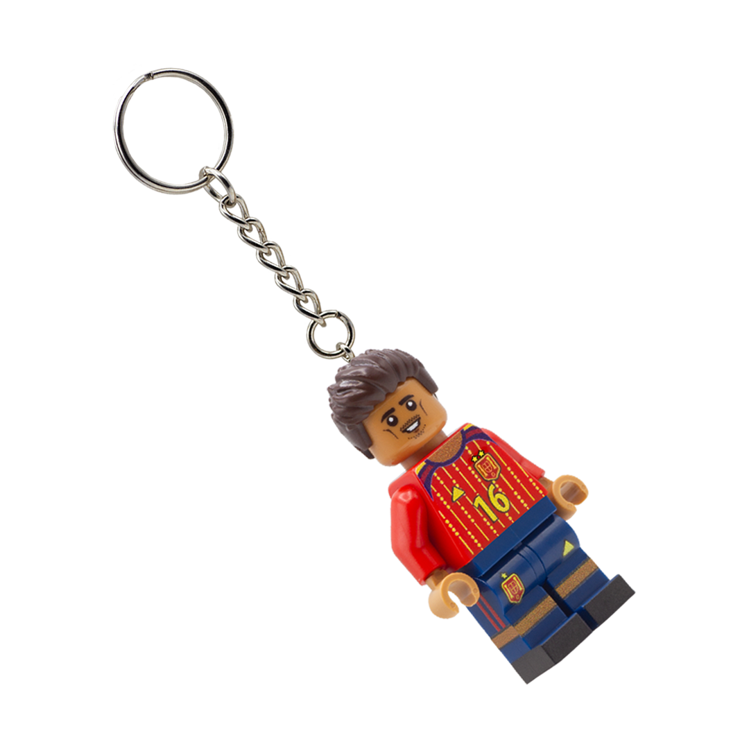 LEGO figure keychain with a red shirt and blue pants on a white background - designed based on the soccer player Rodrigo from Spain.