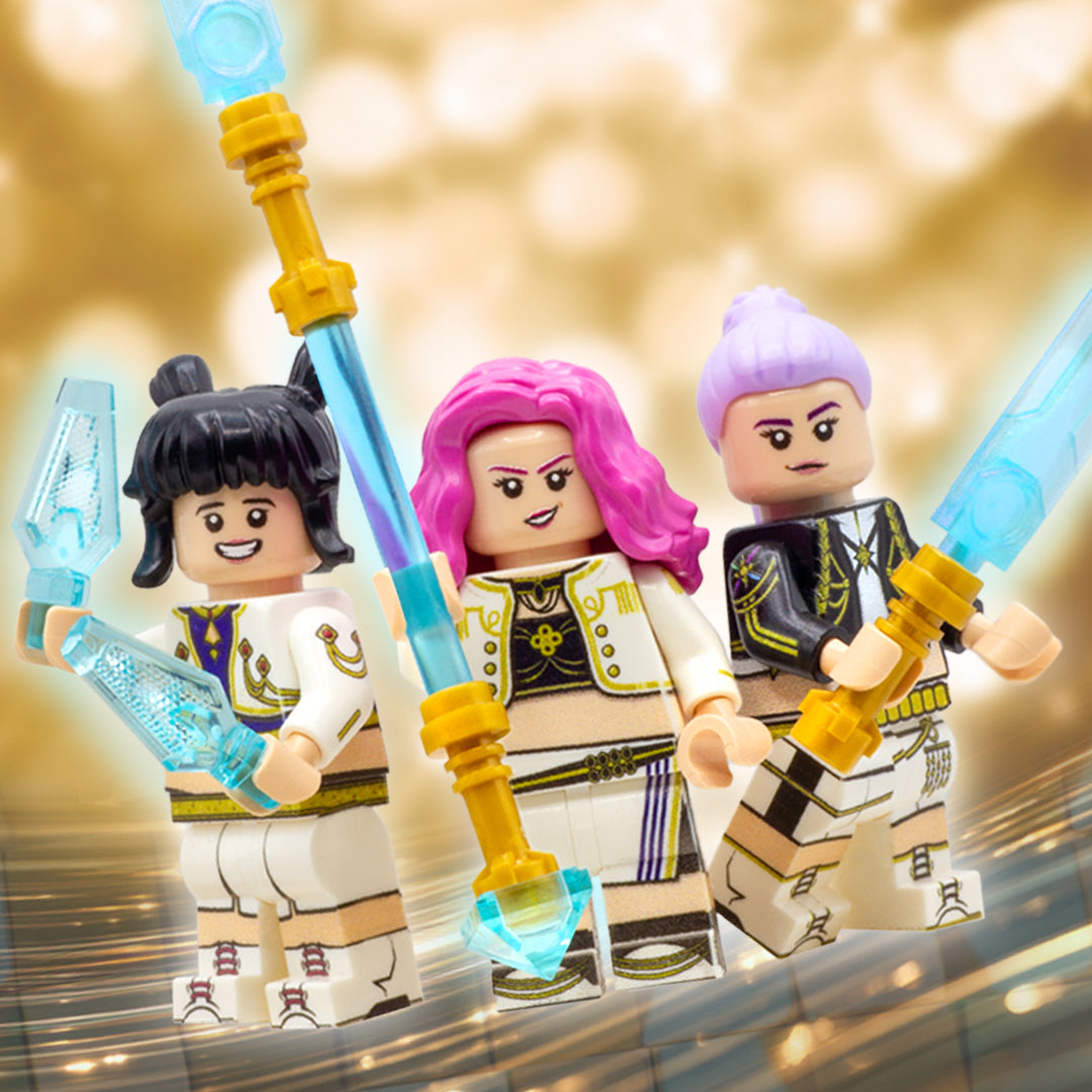 Rumi, Mira and Zoey-inspired custom minifigures holding their weapons.