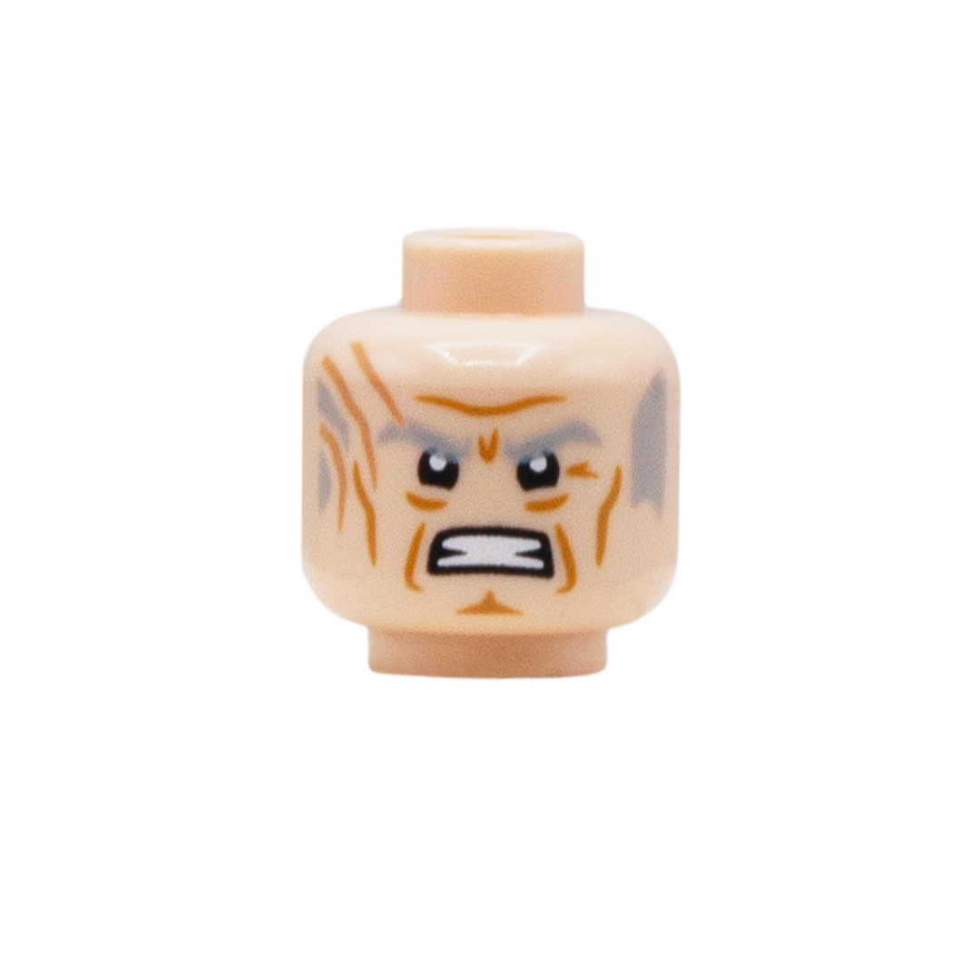 A single LEGO minifigure head piece with a pale peach skin tone, printed with an angry expression, orange scars and gray hair on the sides, isolated on a white background.