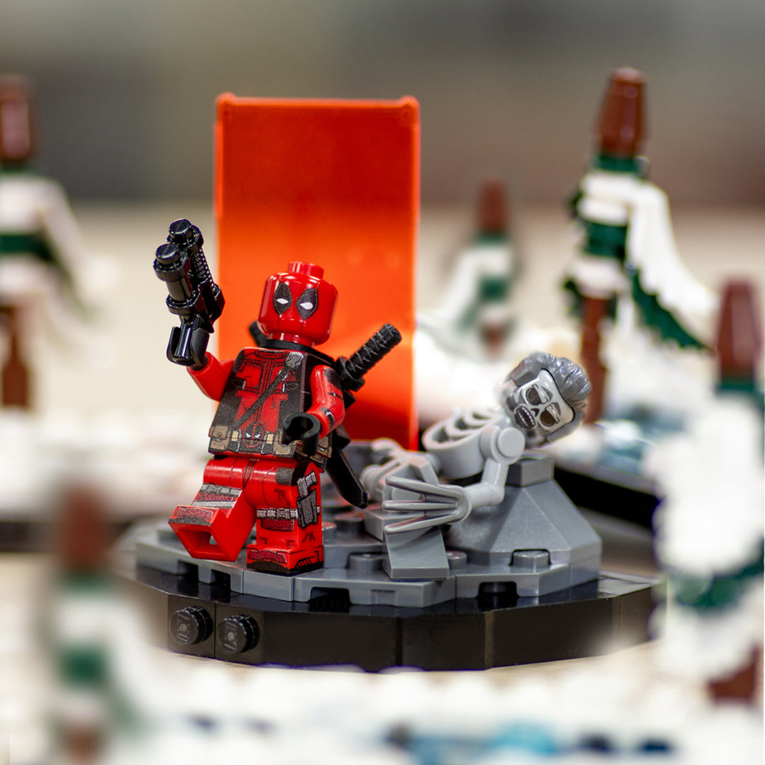 Custom LEGO display based on the scene from Deadpool and Wolverine movie, featuring orange Timedoor and the remains of Wolverine in LEGO form.
