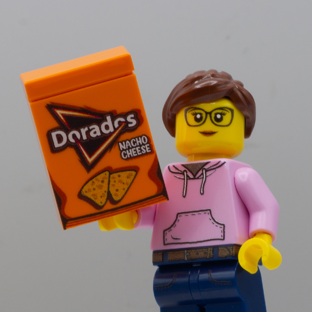 custom LEGO minifigure holding LEGO doritos (dorados) in nacho cheese flavour