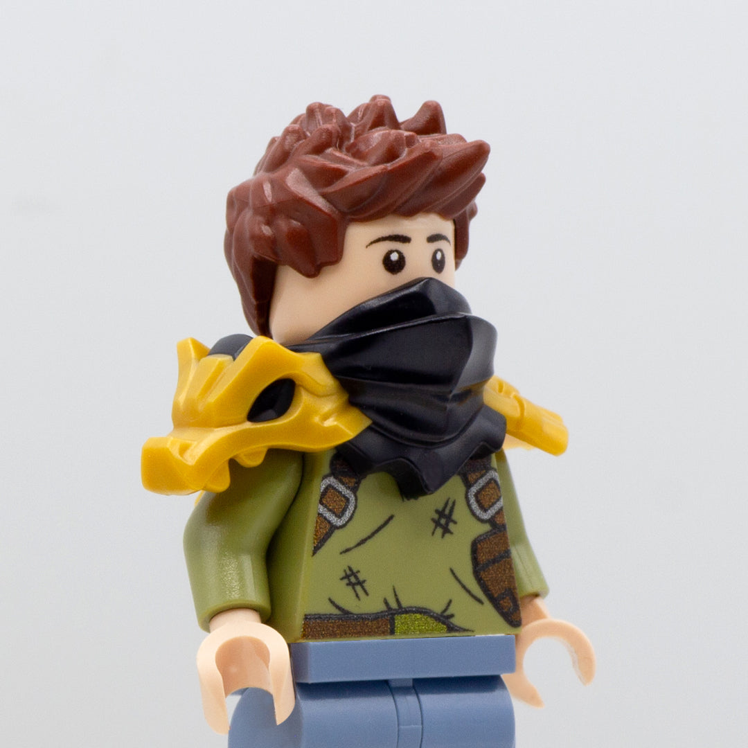 Minifigure wearing golden LEGO Ninjago armour shoulder pads with black mouth-covering bandana and a dragon on the right shoulder.