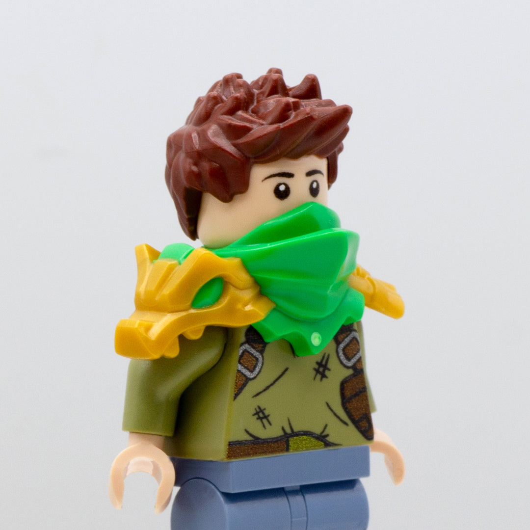 Minifigure wearing golden LEGO Ninjago armour shoulder pads with green mouth-covering bandana and a dragon on the right shoulder.