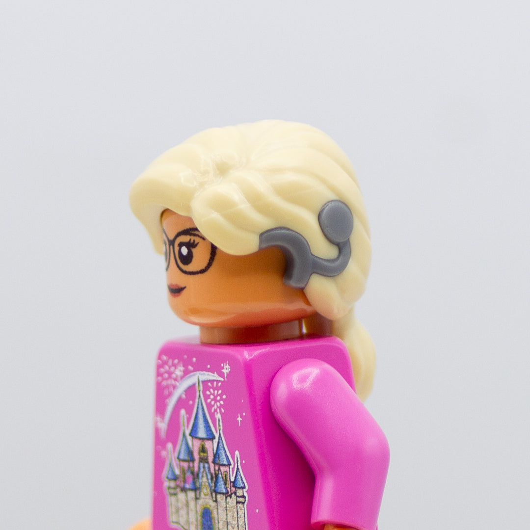Minifigure wearing LEGO blonde minifigure hair in a ponytail with a hearing aid