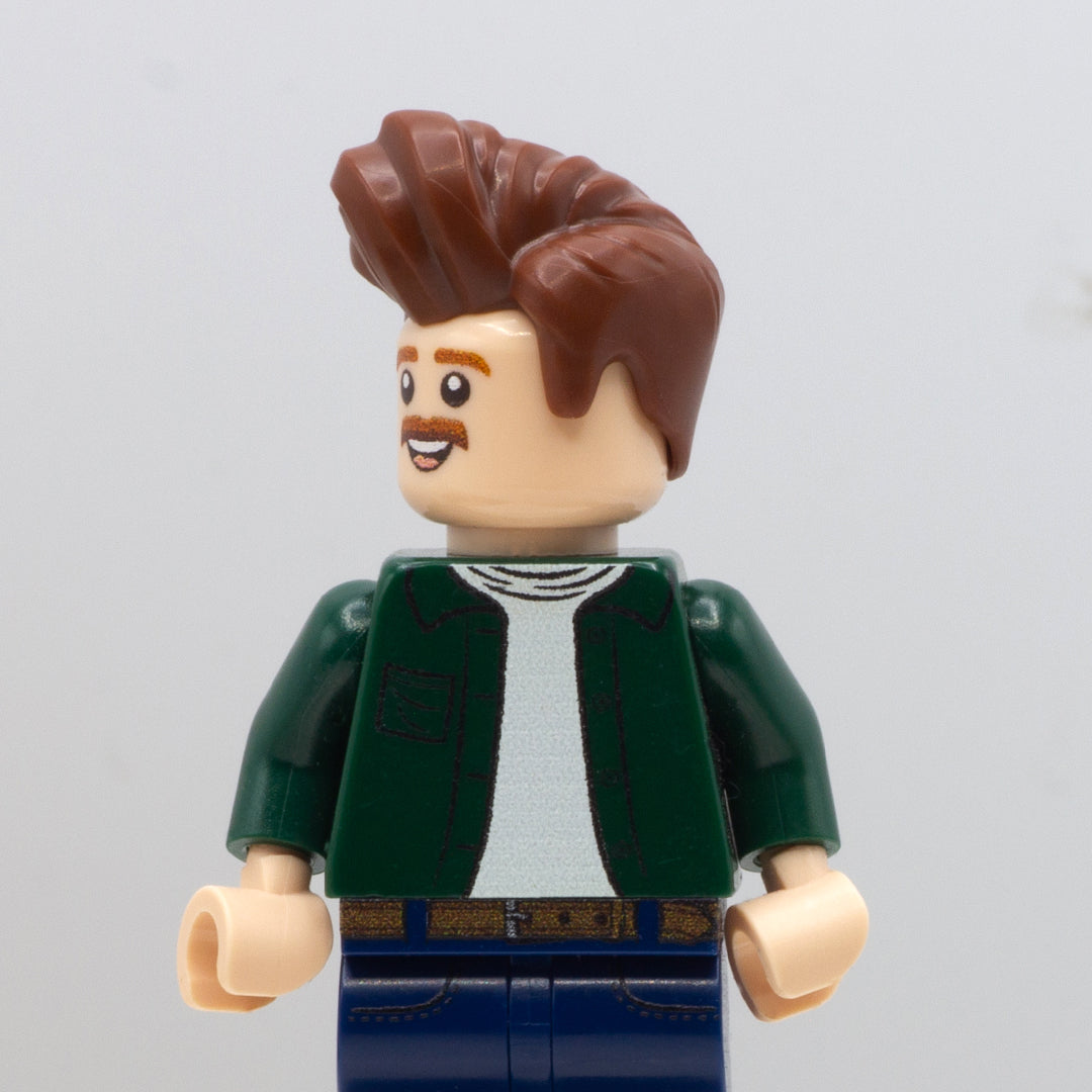 LEGO minifigure wearing brown short LEGO minifigure hair with a high quiff in Elvis style.