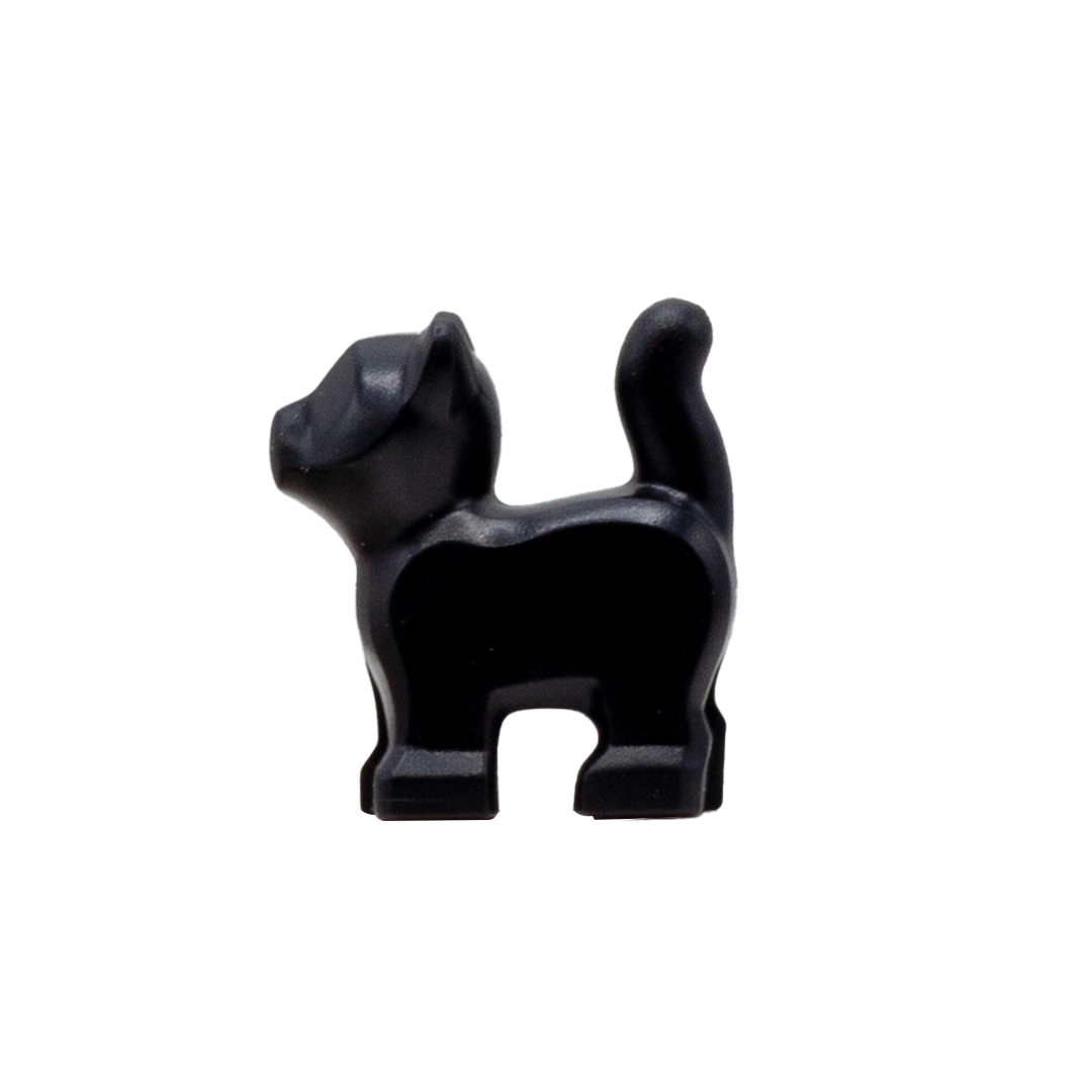 A small black LEGO  kitten with no prints. Side view.
