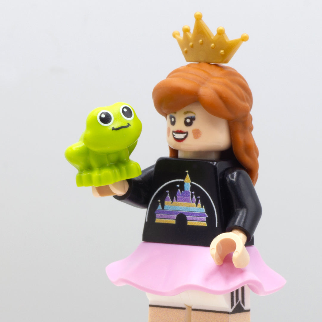 LEGO minifigure dressed like a princess holding LEGO Friends frog.