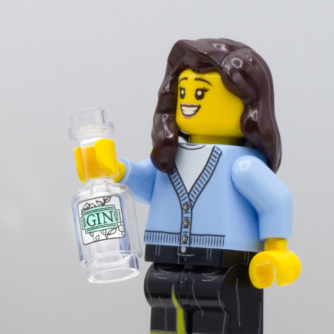 Minifigure holding a pretend bottle of vodka with label printed on genuine LEGO bottle.