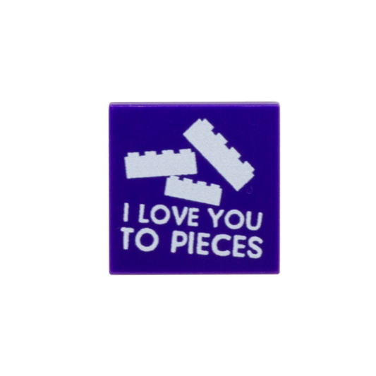 A square purple custom LEGO tile featuring white LEGO-style brick graphics and the text 'I LOVE YOU TO PIECES'.