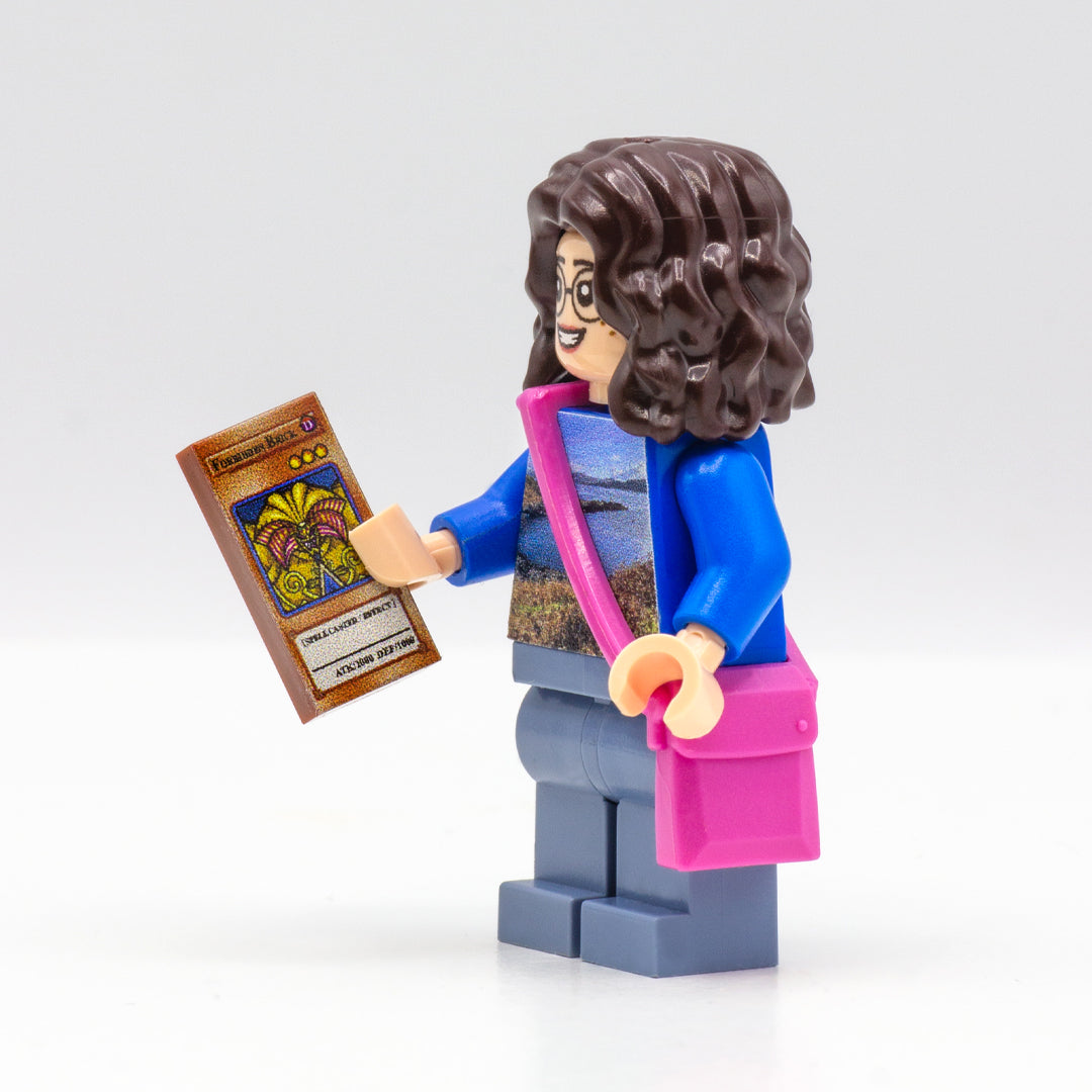 Custom LEGO minifigure holding a custom-printed tile inspired by Duel Monsters game card. 