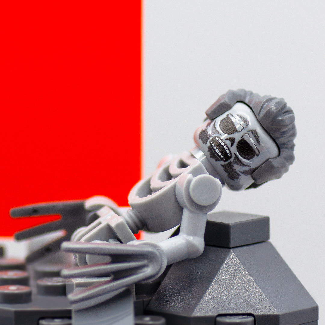 Custom LEGO display based on the scene from Deadpool and Wolverine movie, featuring orange Timedoor and the remains of Wolverine in LEGO form. Close up of the detailed print on Wolverine's head.