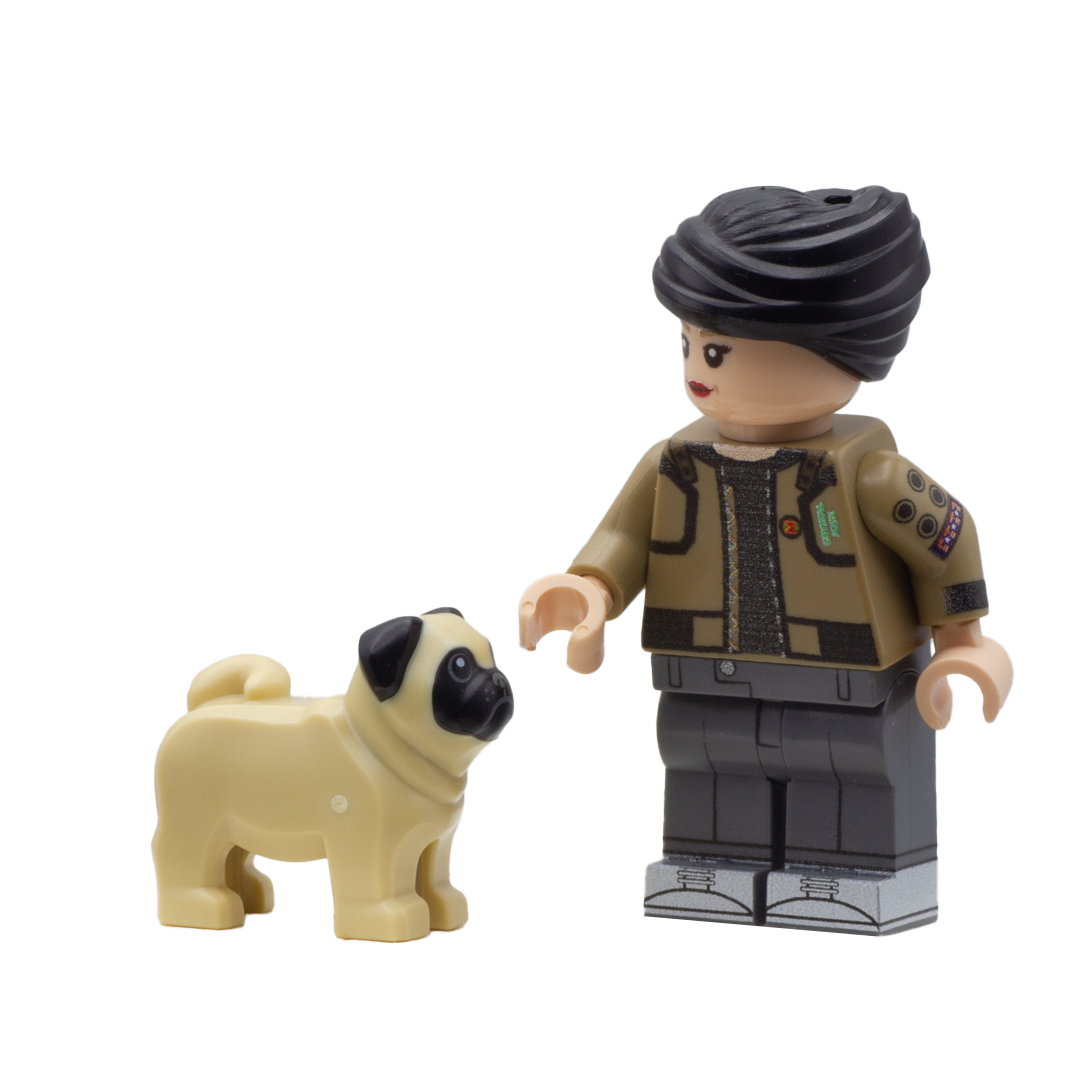 Minifigure standing next to a small LEGO pug minifigure accessory