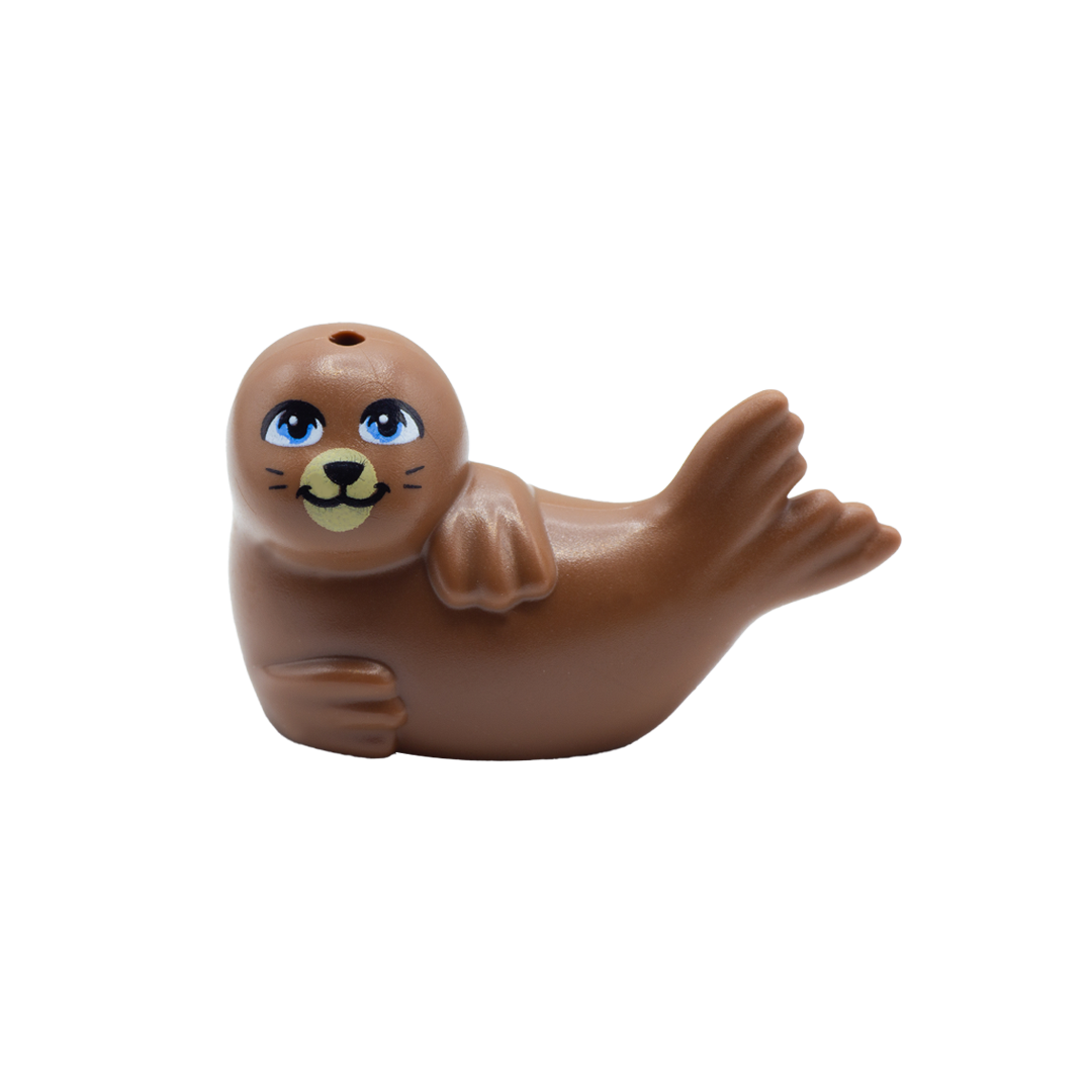 Brown LEGO seal laid on its side with cute smile and big blue eyes.