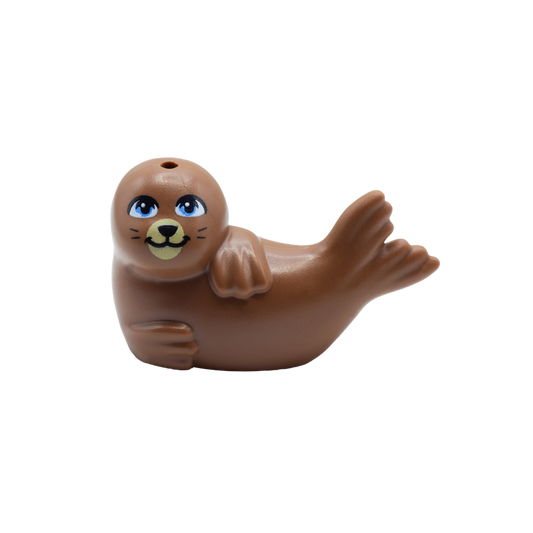 Brown LEGO seal laid on its side with cute smile and big blue eyes.