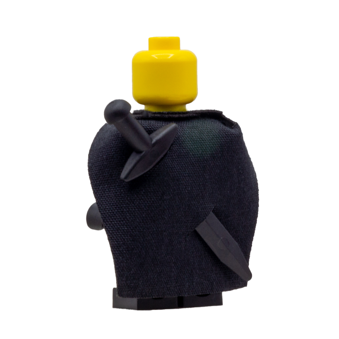 Minifigure wearing a black fabric cape with slots for LEGO swords.