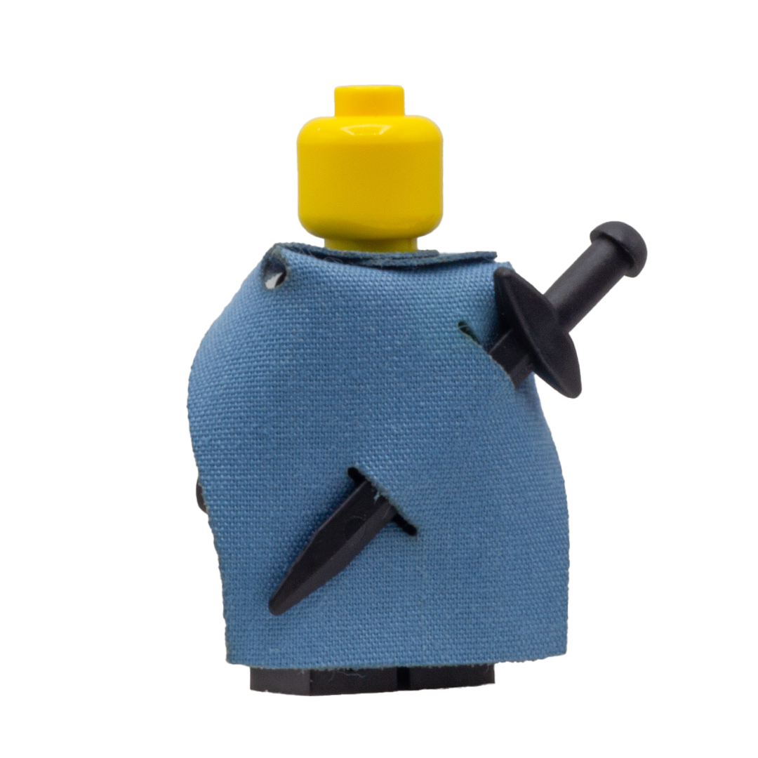Minifigure wearing a teal fabric cape with slots for LEGO swords.
