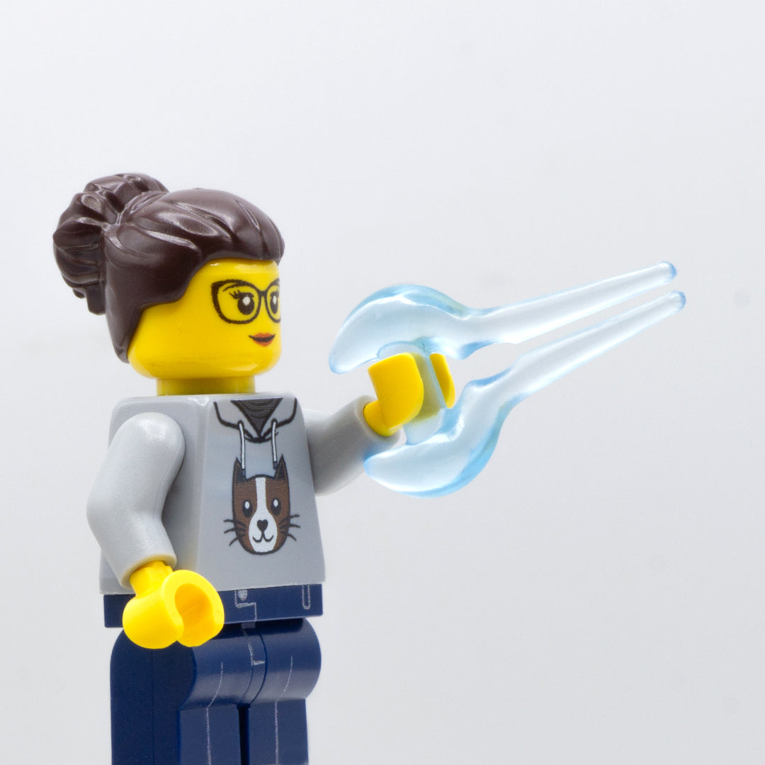 A minifigure holding translucent blue power sword.