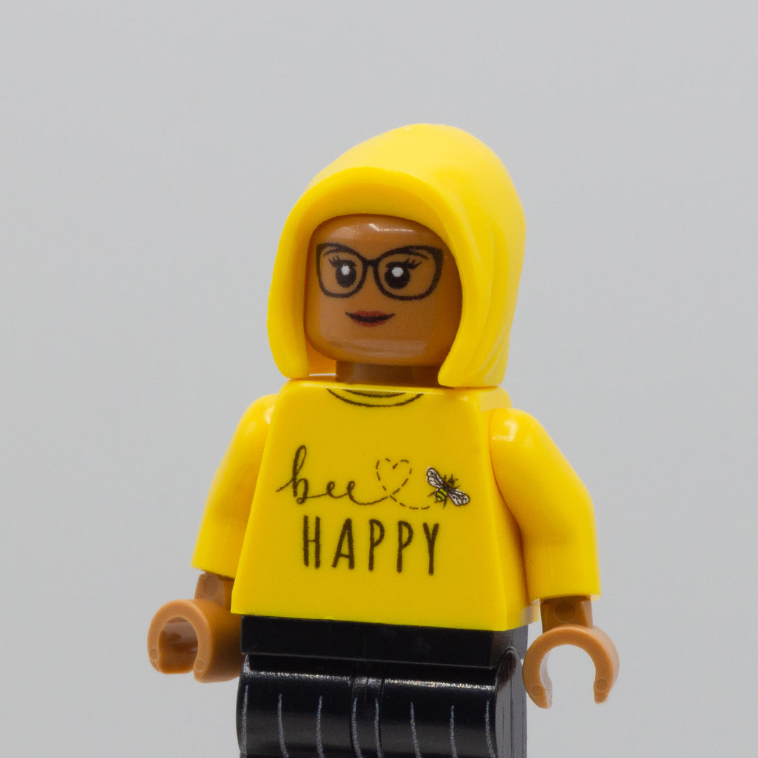 Custom LEGO minifigure wearing a yellow jumper and yellow LEGO hood minifigure accessory.