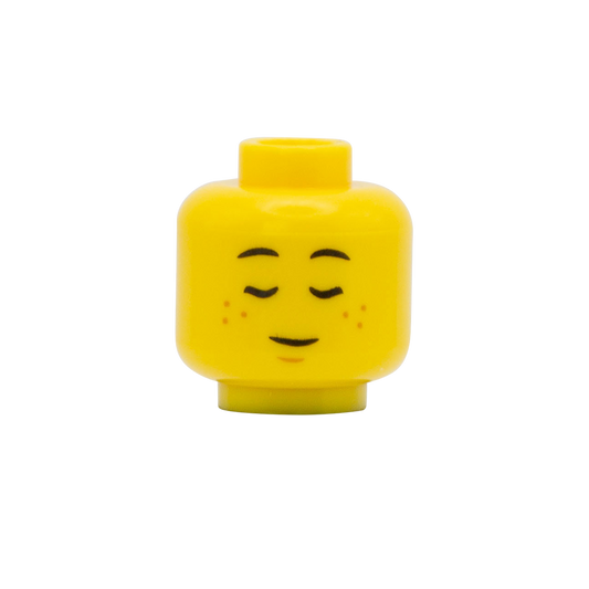 lego minifigure head with closed sleeping eyes and freckles