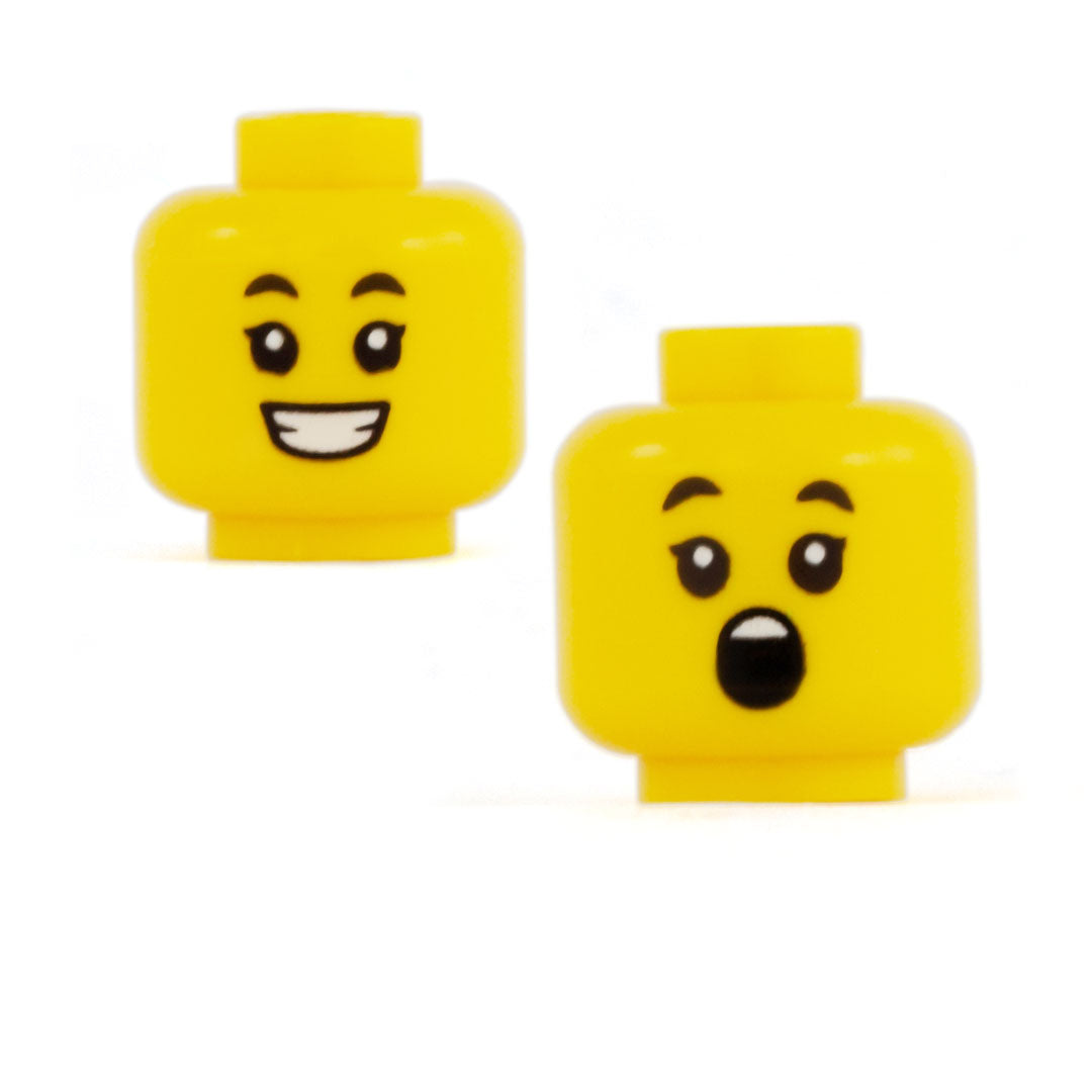 LEGO feminine or female minifigure head with a big smile and shocked expression